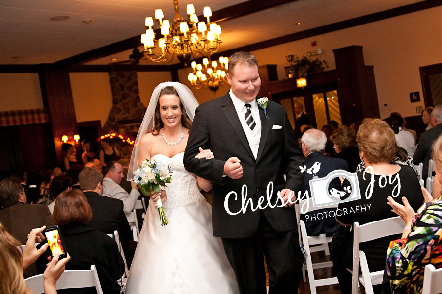 Bride and groom walk down the aisle at their St. Andrews Golf & Country Club wedding.