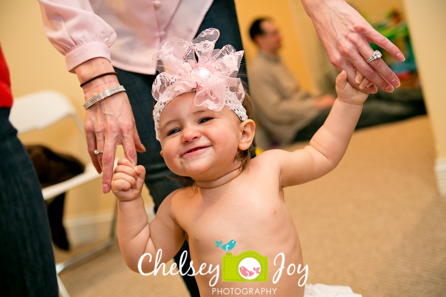 Baby J smiles at her 1st birthday party.