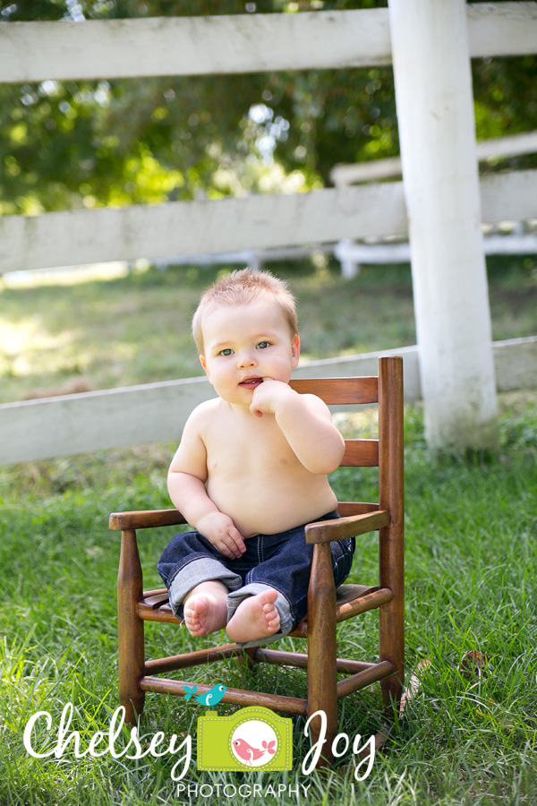 Jackson sits in an antique rocking chair during his 1 year photo session. 