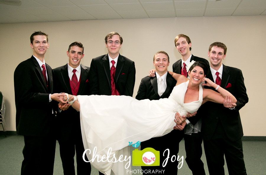 Photo of groomsmen with bride at Hopkins Park wedding. 
