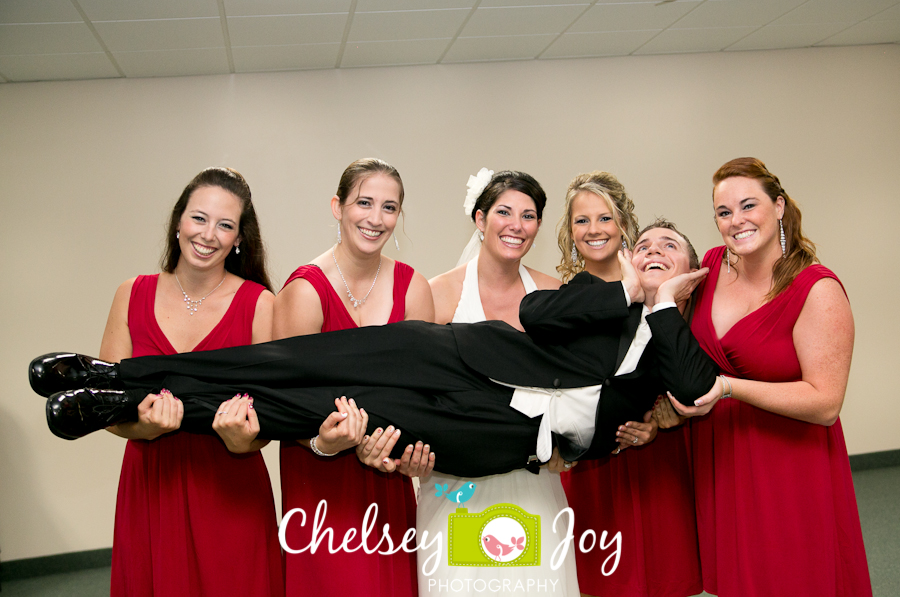 Photo of bridesmaids with groom at Hopkins Park.