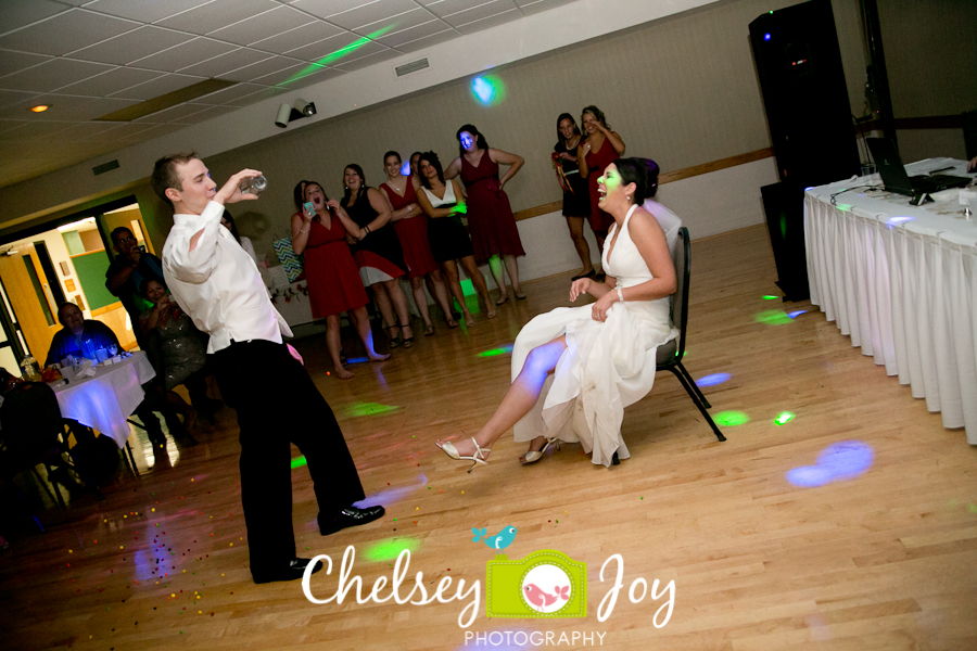 Garter toss at Hopkins Park wedding in DeKalb.