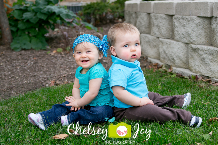 Scarlett and Jackson laugh during their 1 year photo session in Barrington. 