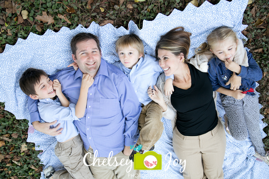 A family laughs during a family lifestyle session in Wheaton. 