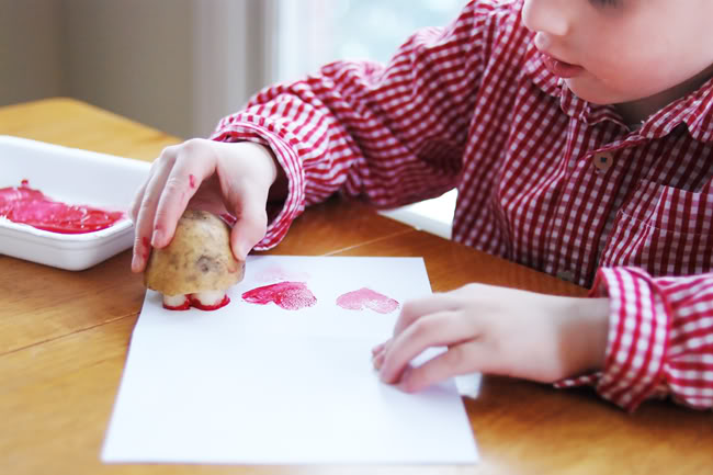 Fun Valentine's Day activity for kids using potato stamp. 