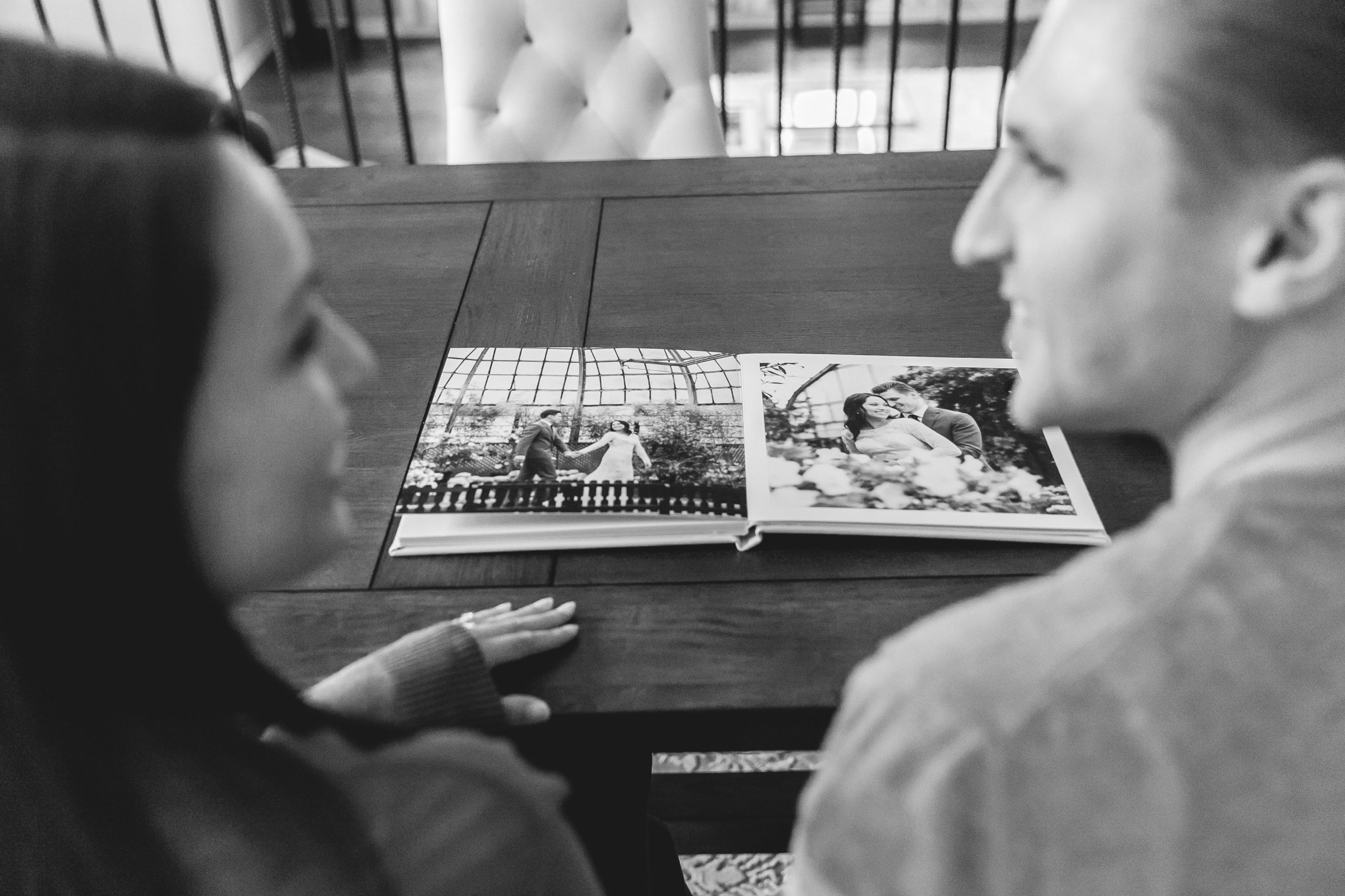 Couple looking at wedding album