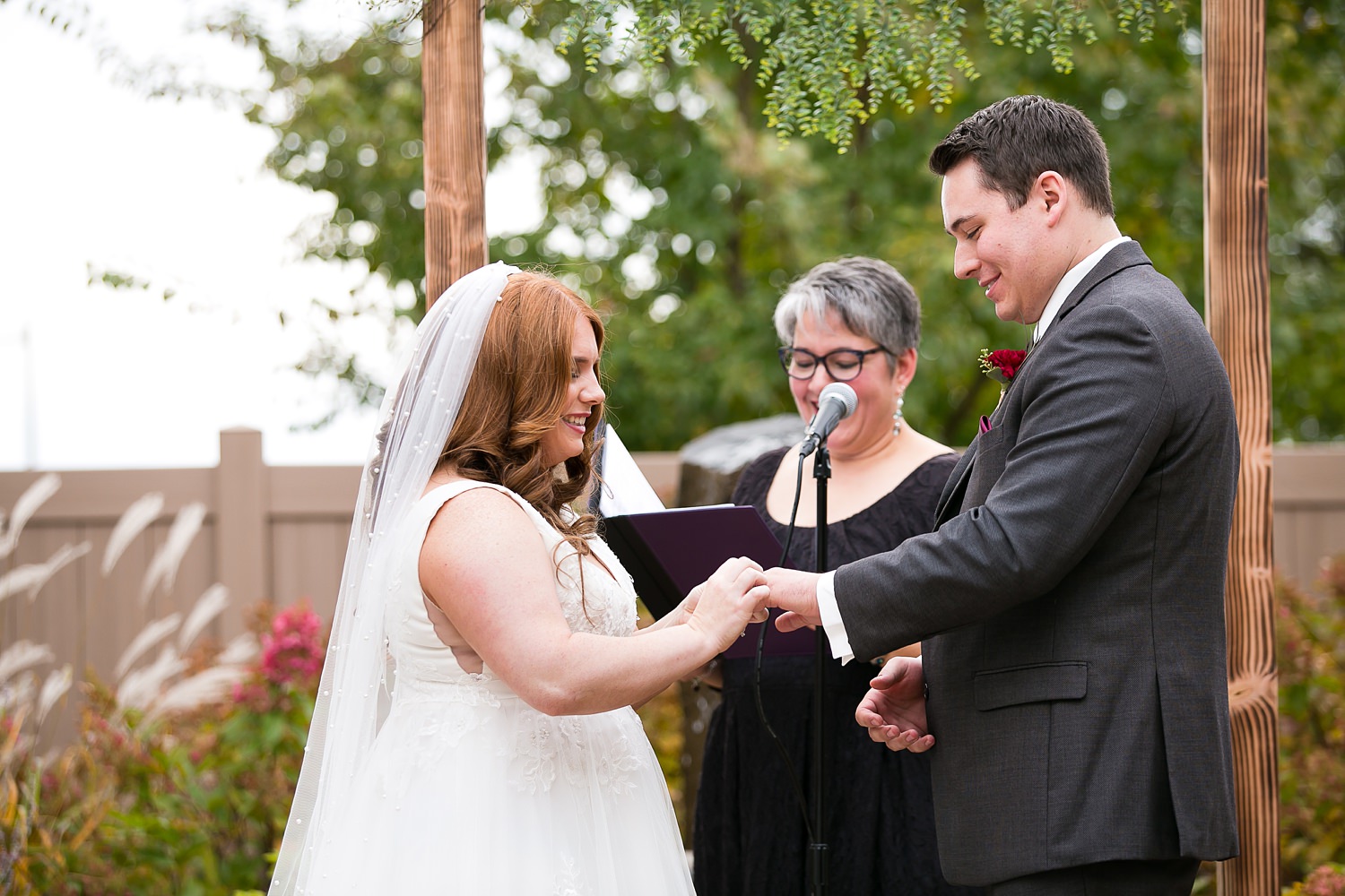 Exchange of rings at Hoosier Grove Barn wedding in Streamwood