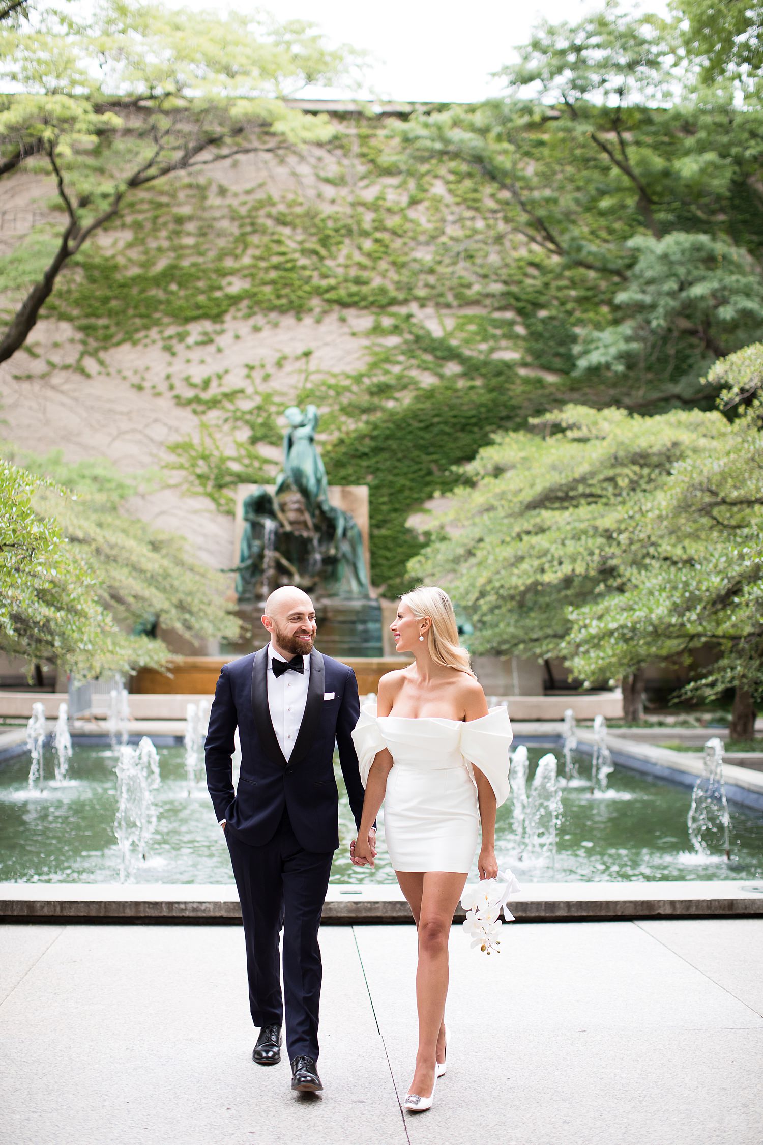 Couple walking in the Art Institute Garden for their elopement in Chicago