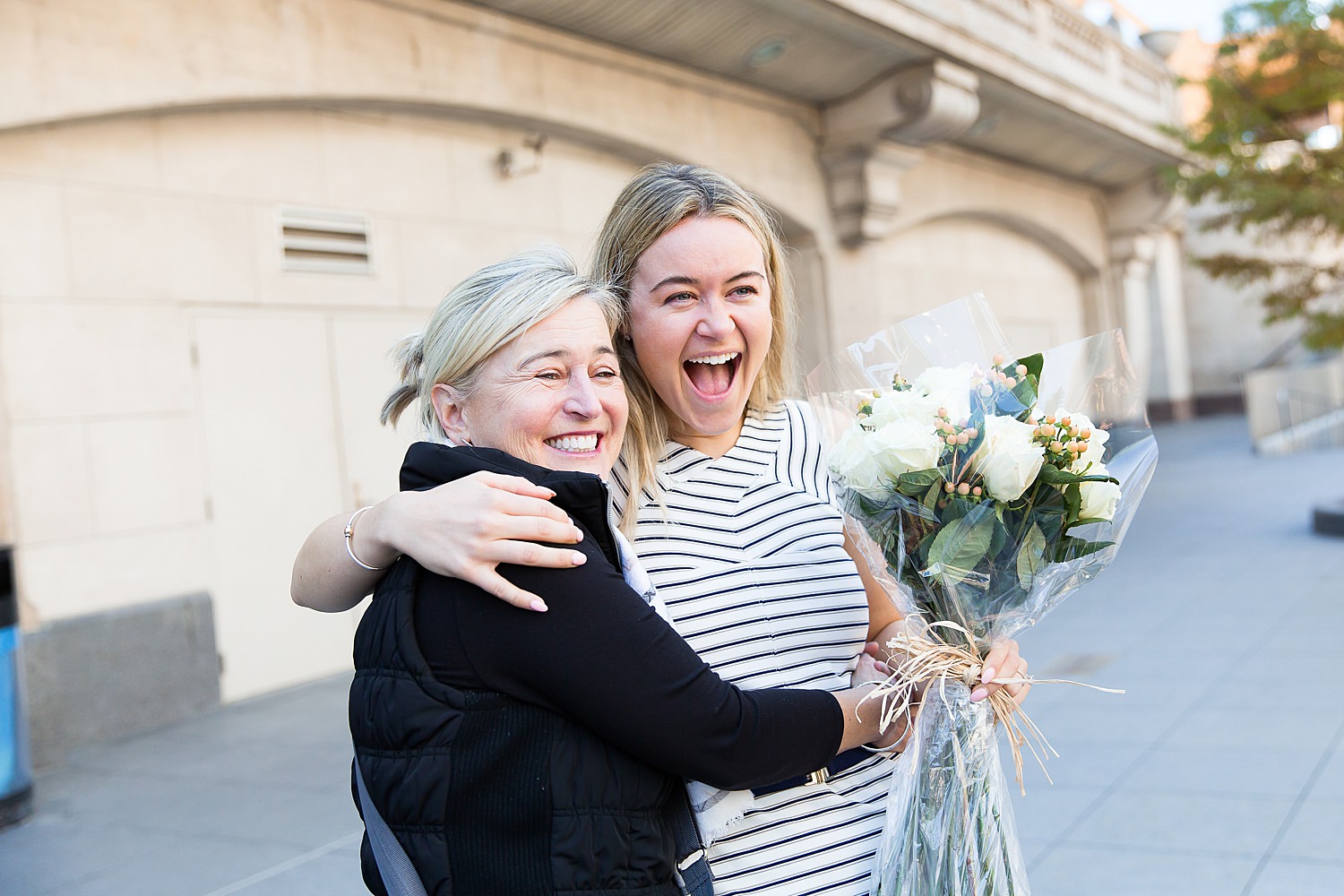 Julia hugs mom as their celebrate her engagement.