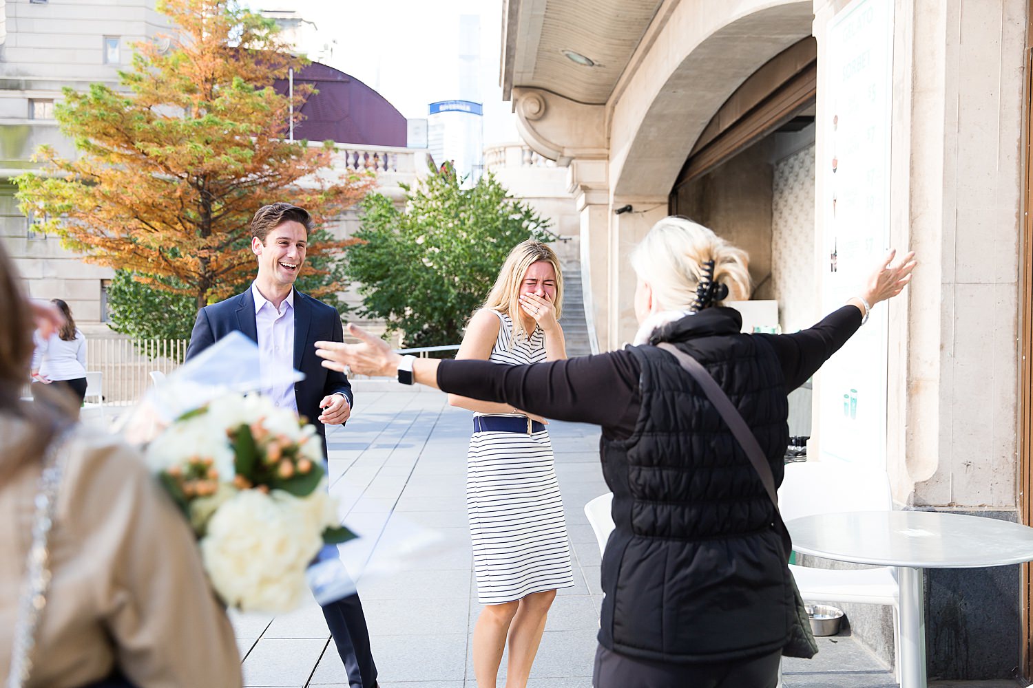 Family surprises couples after their Chicago proposal.