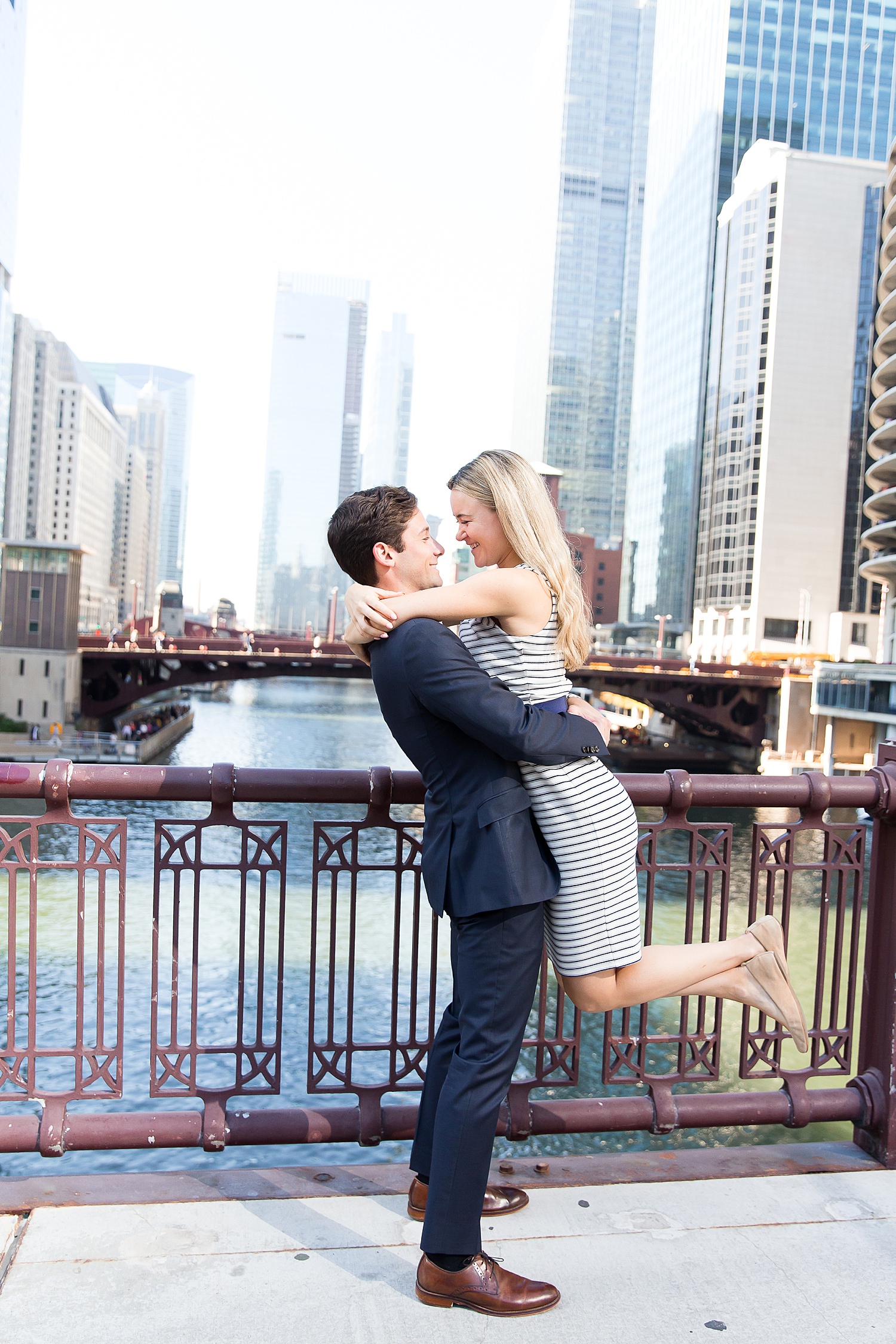 Evan picks up Julia on bridge in Chicago.