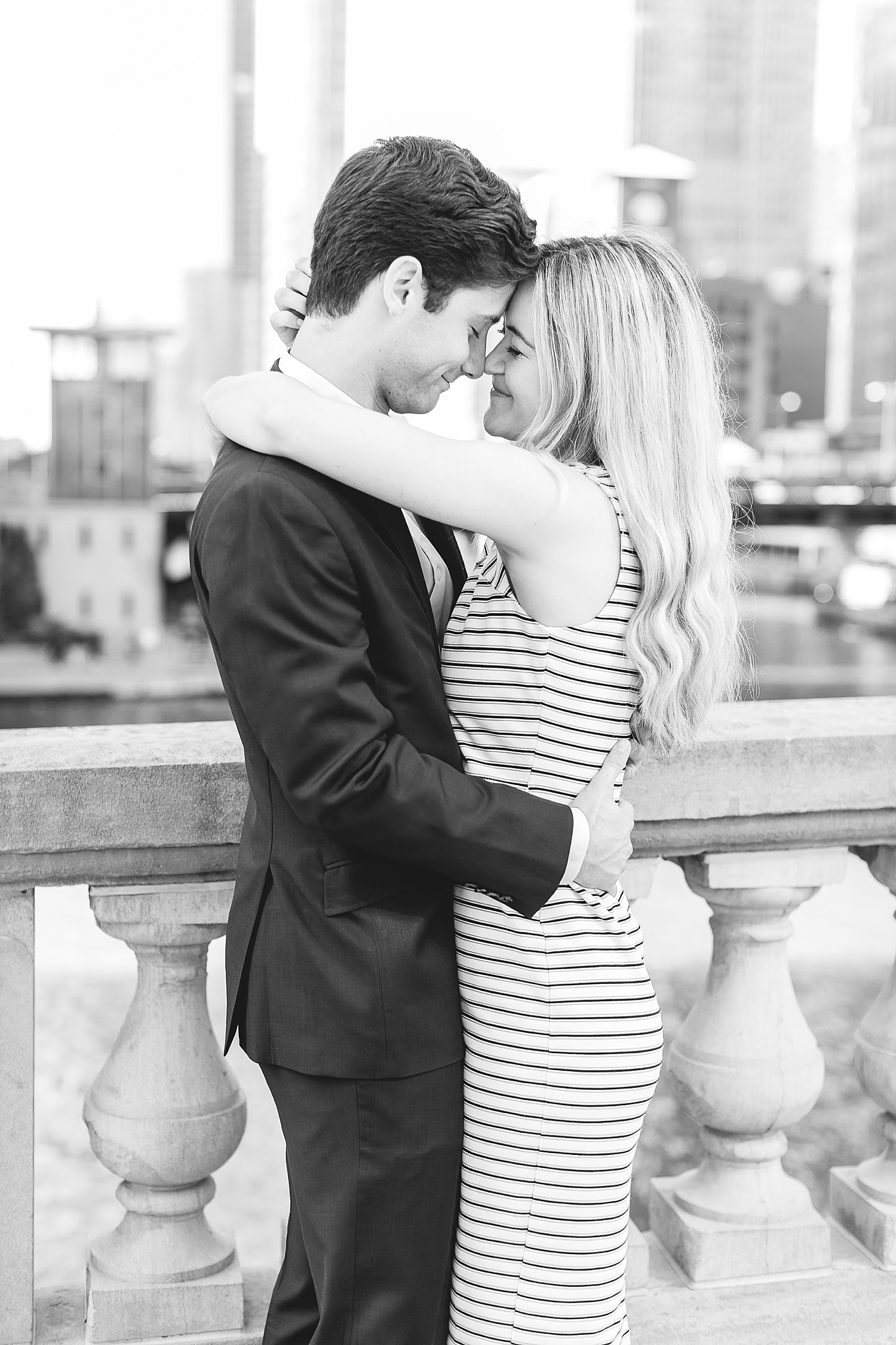 Couple hugs after their proposal in Chicago.