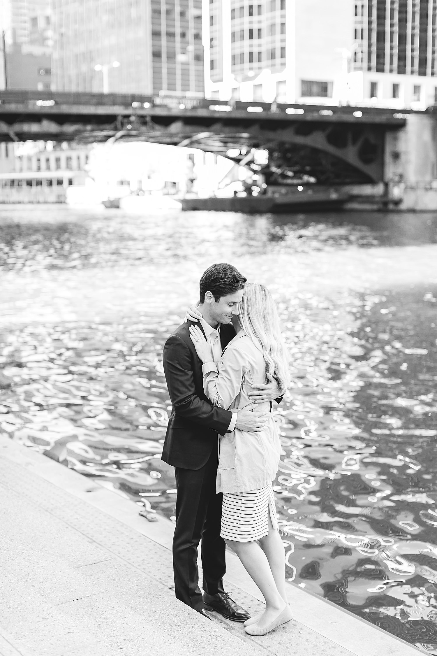 Couple hugs after their proposal in Chicago.