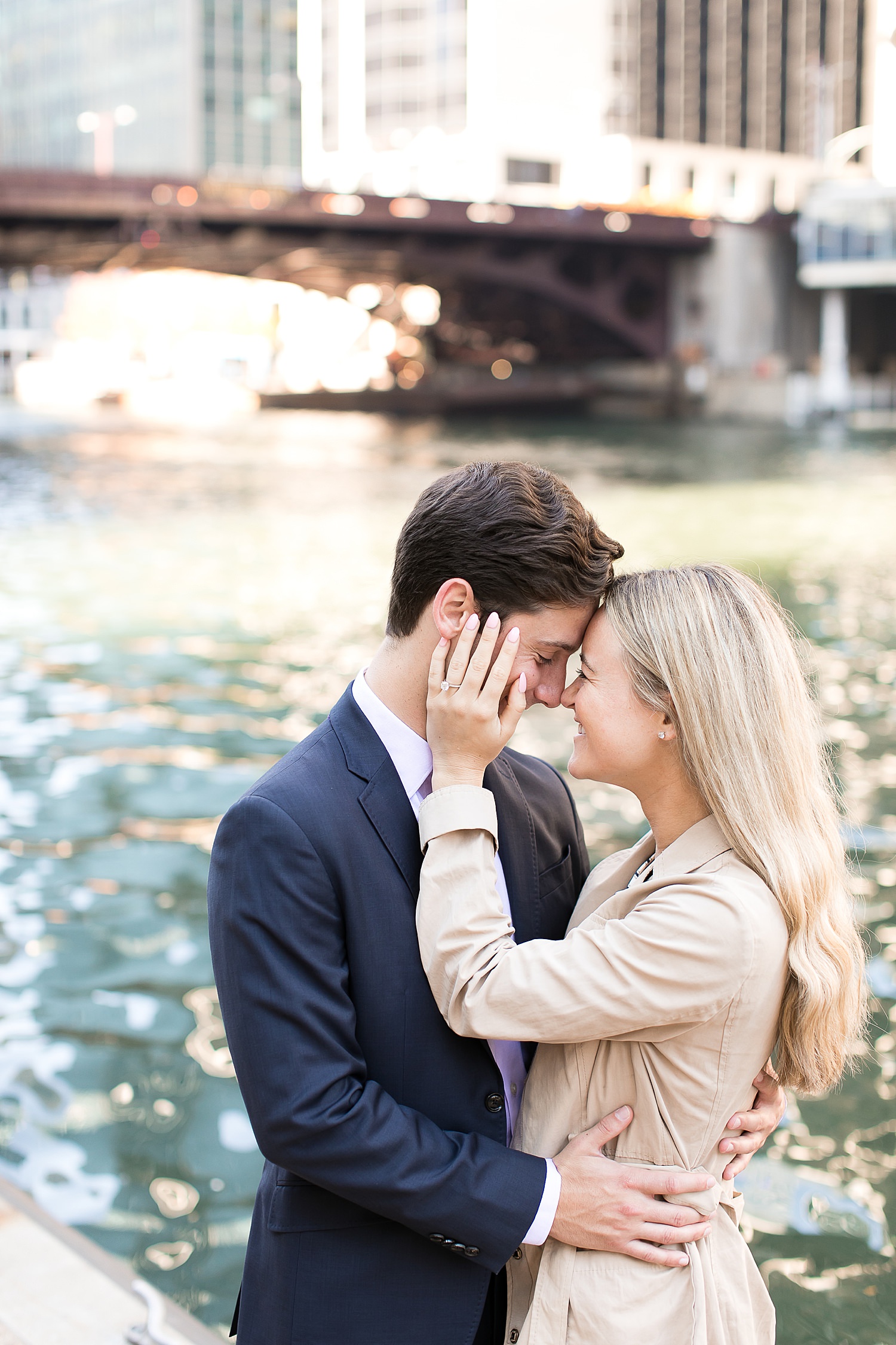 Couple takes engagement photos by the Chicago Riverwalk.