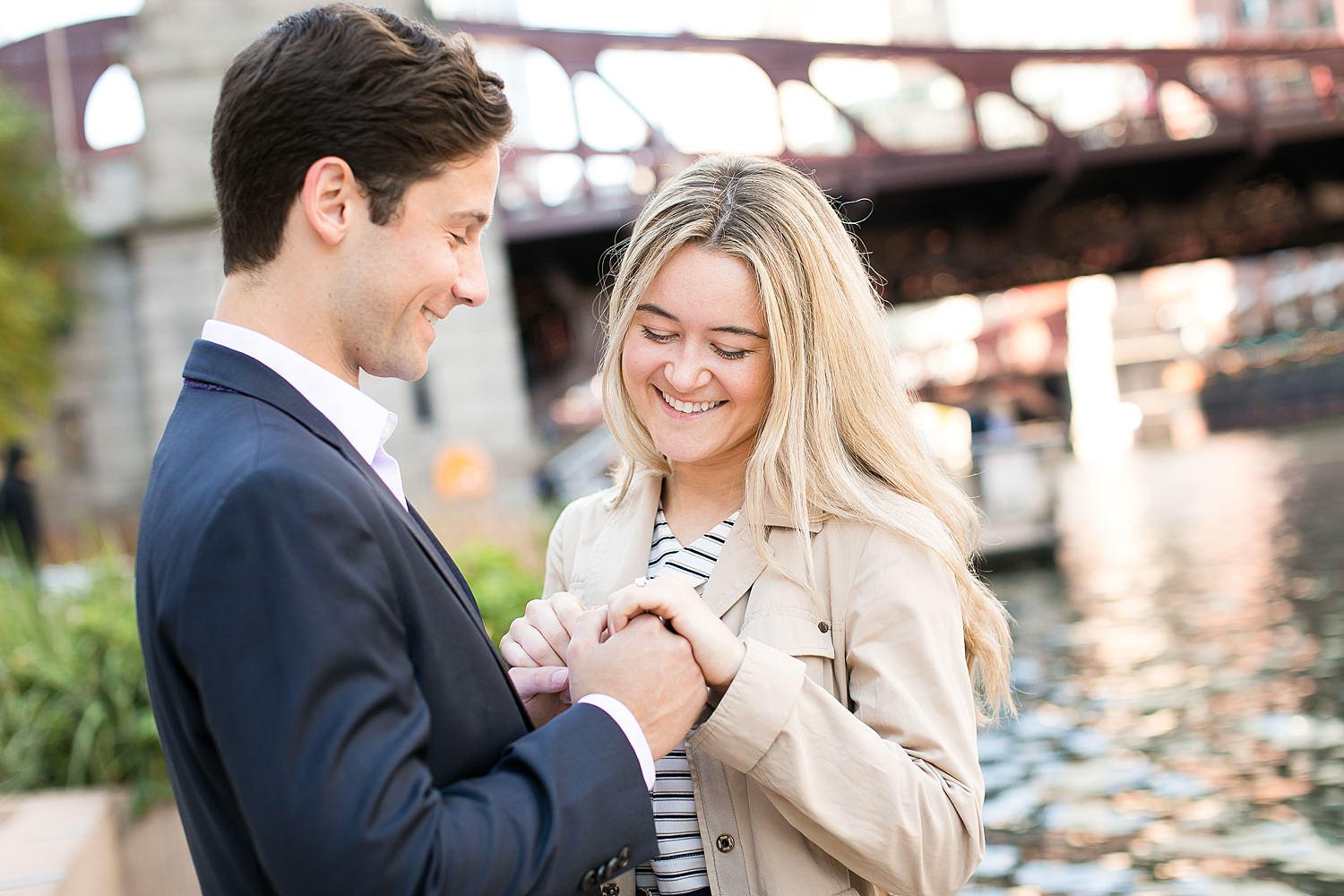 Couple look at engagement ring after their Chicago proposal