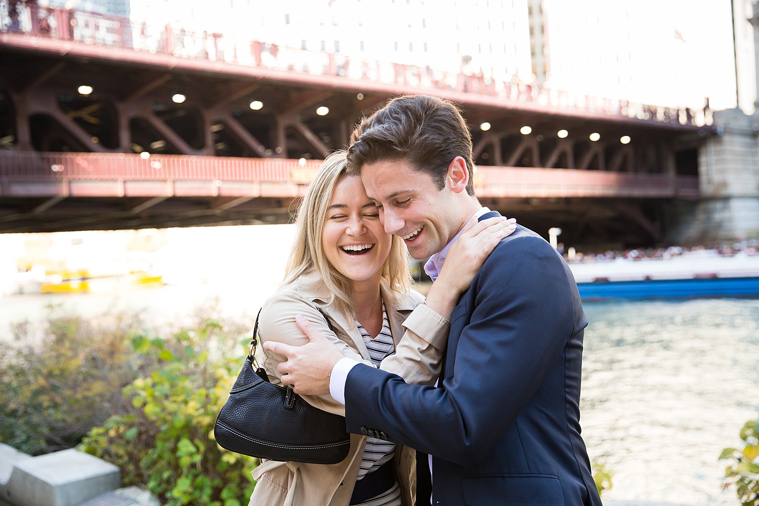 Julia hugs Evan after their Chicago Riverwalk proposal.