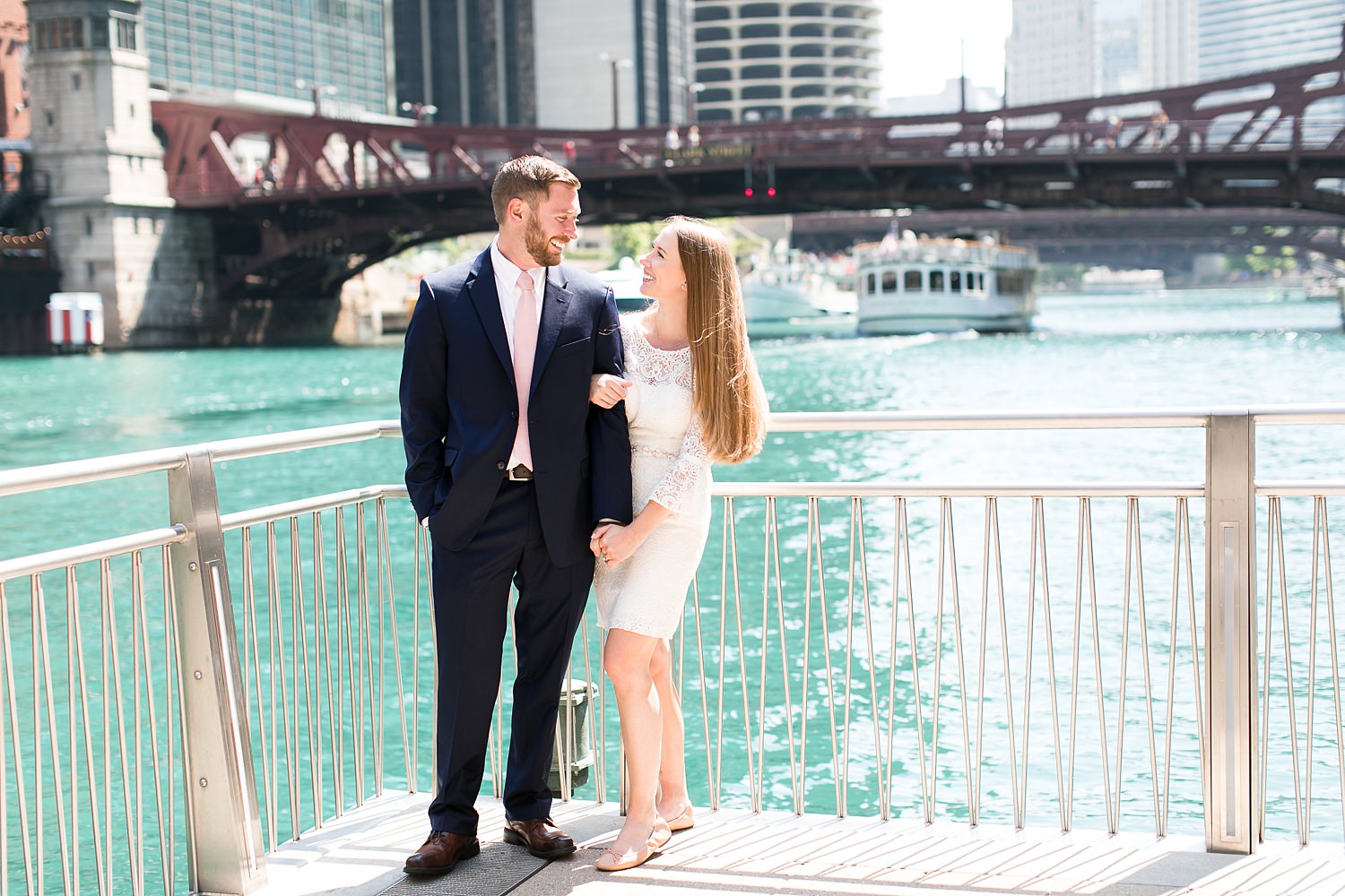 Couple stands by Chicago Riverwalk.