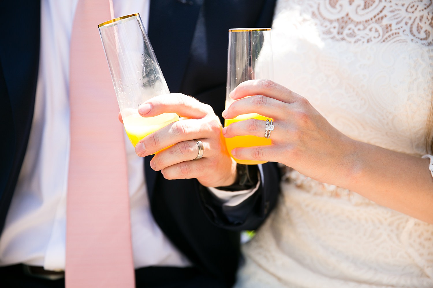 Couple toasts mimosas by the Chicago Riverwalk.