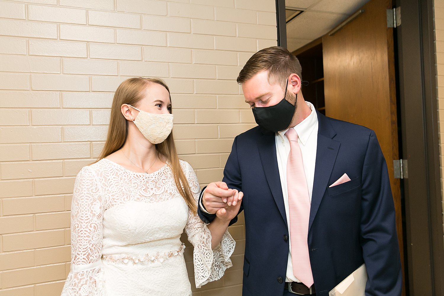 Couple waits outside door for their ceremony at Chicago City Hall.