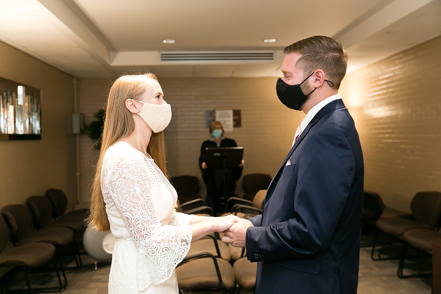 Couple exchanges rings at Chicago City Hall.