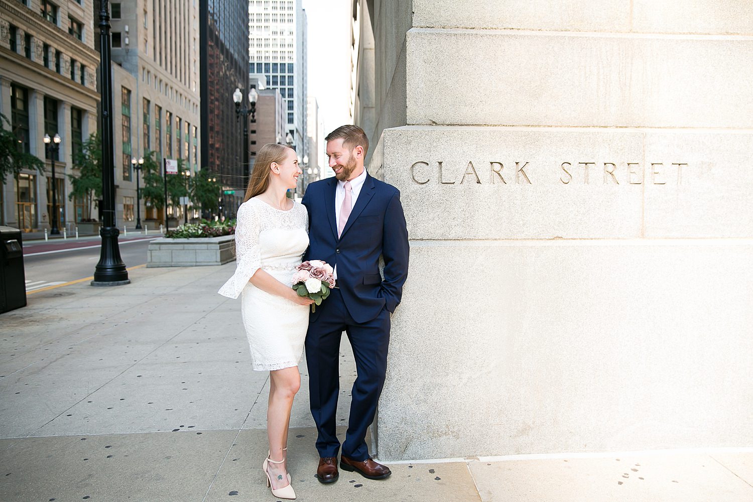 Couple stands outside courthouse in Chicago.