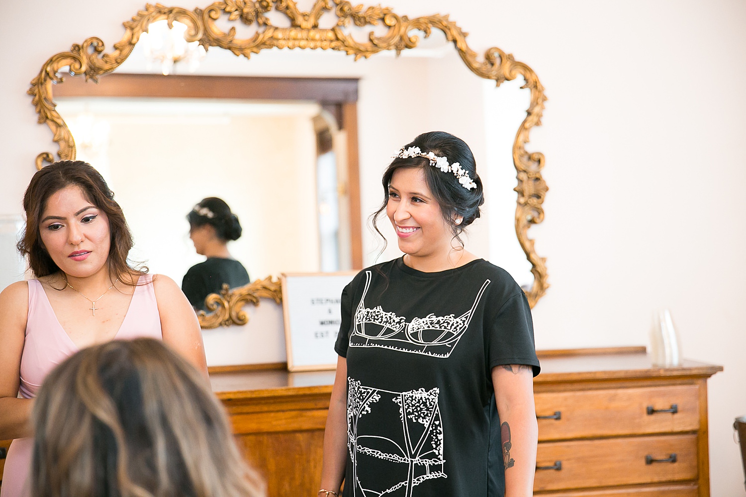 Bride smiles while getting ready at The Haight.