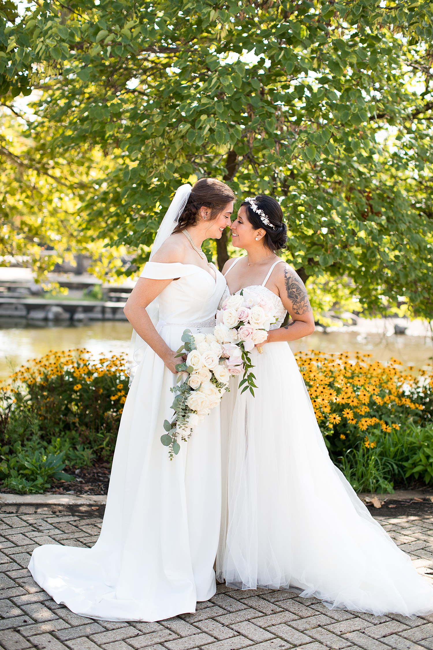 Brides holding bouquets.