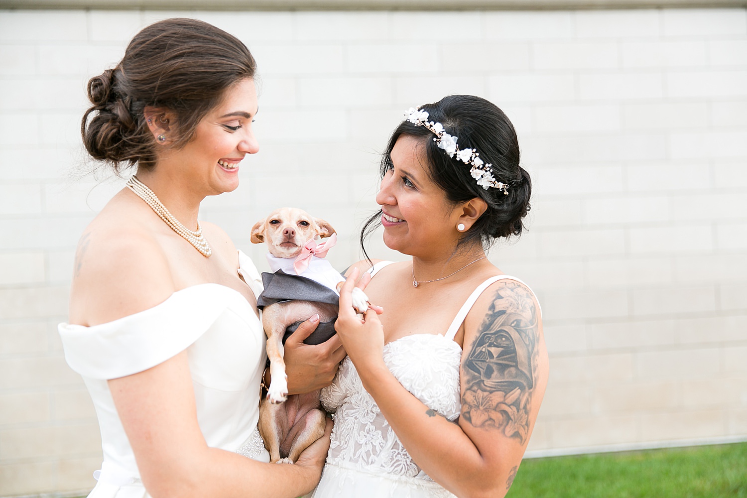 Brides with their dog wearing bow tie.
