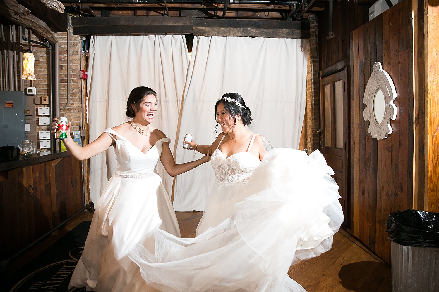 Brides dance into their wedding reception.
