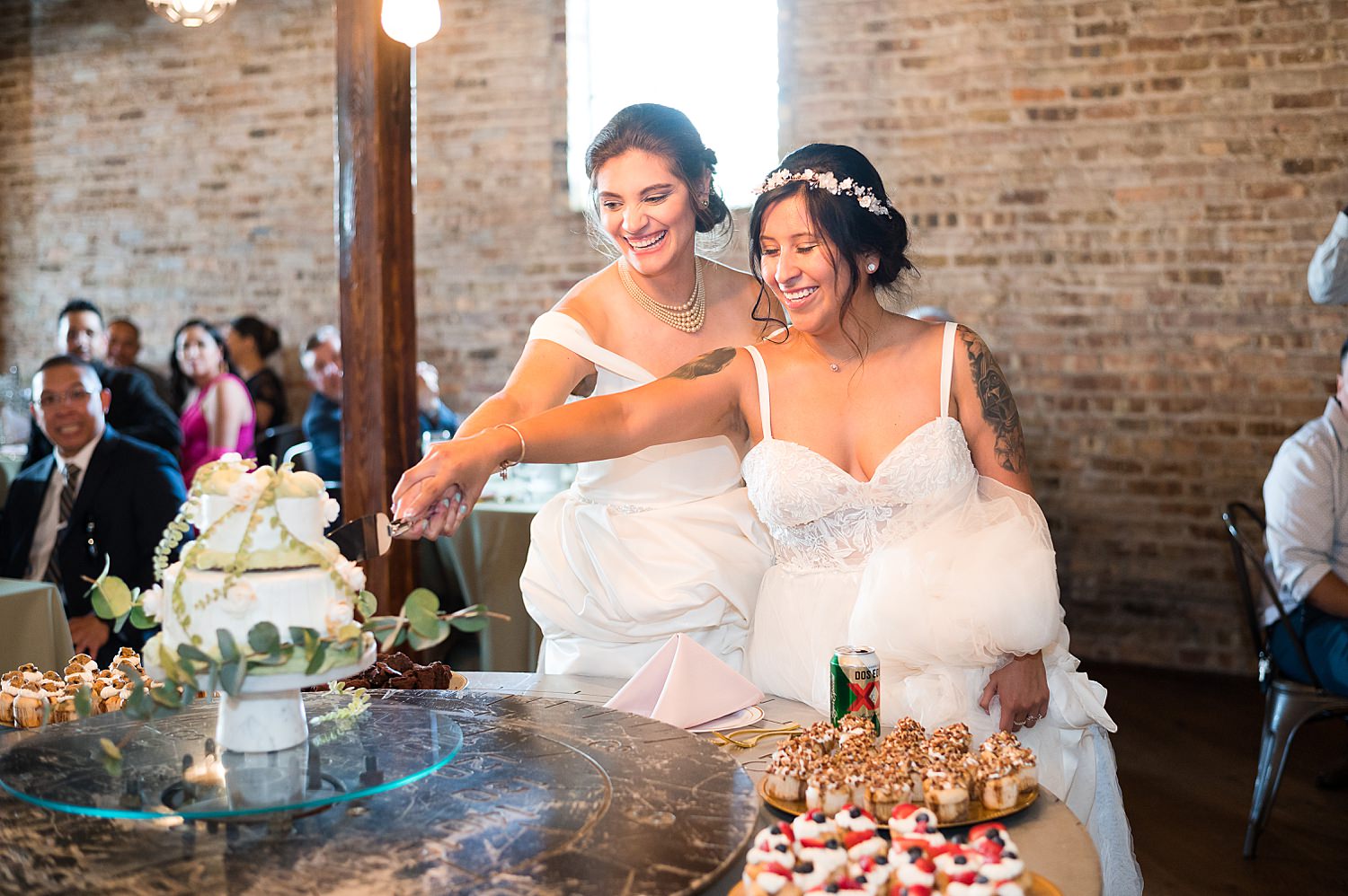 Brides cut wedding cake at The Haight.