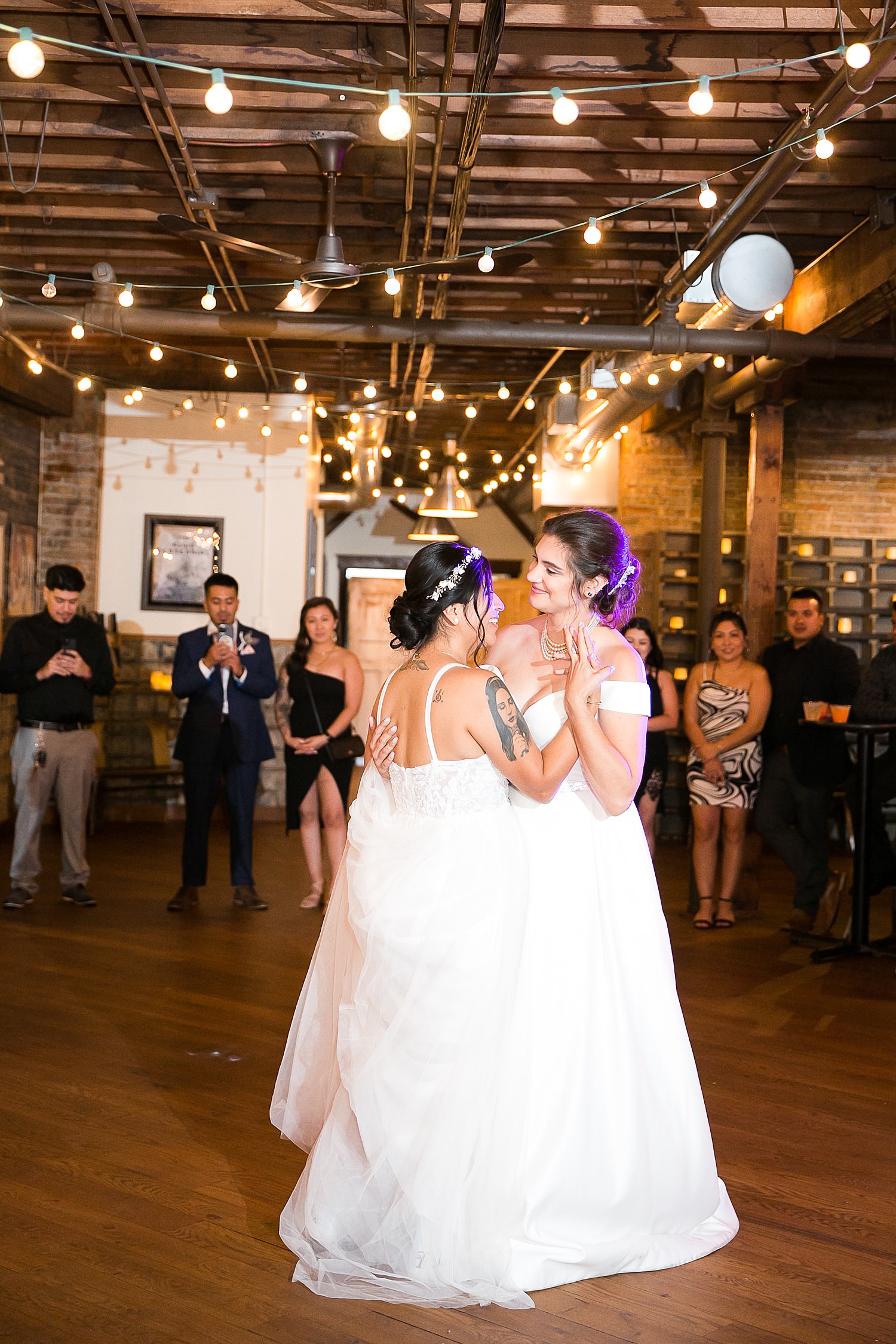 Brides have first dance at their wedding reception at The Haight.