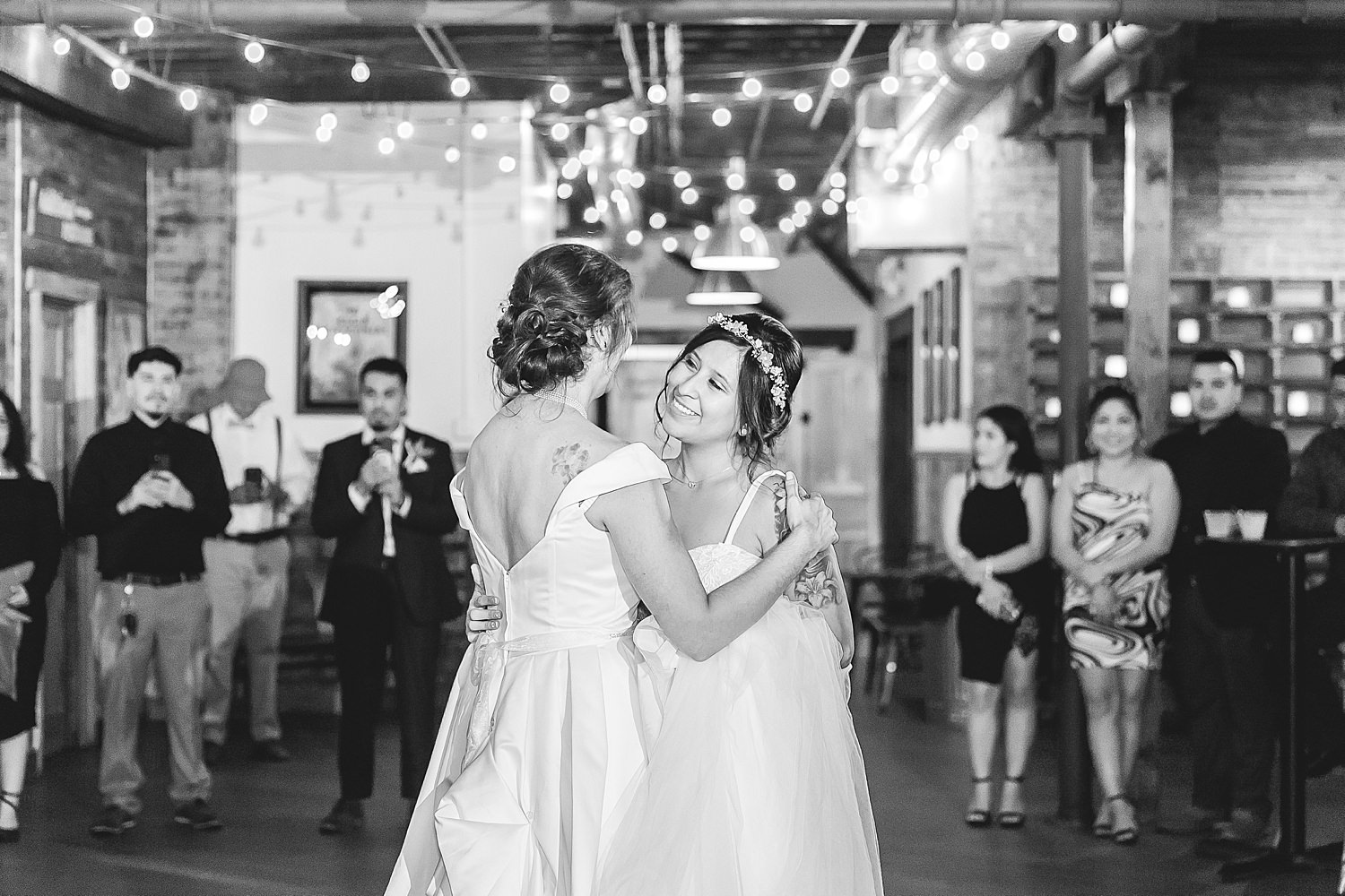 Brides dance at their reception at The Haight.