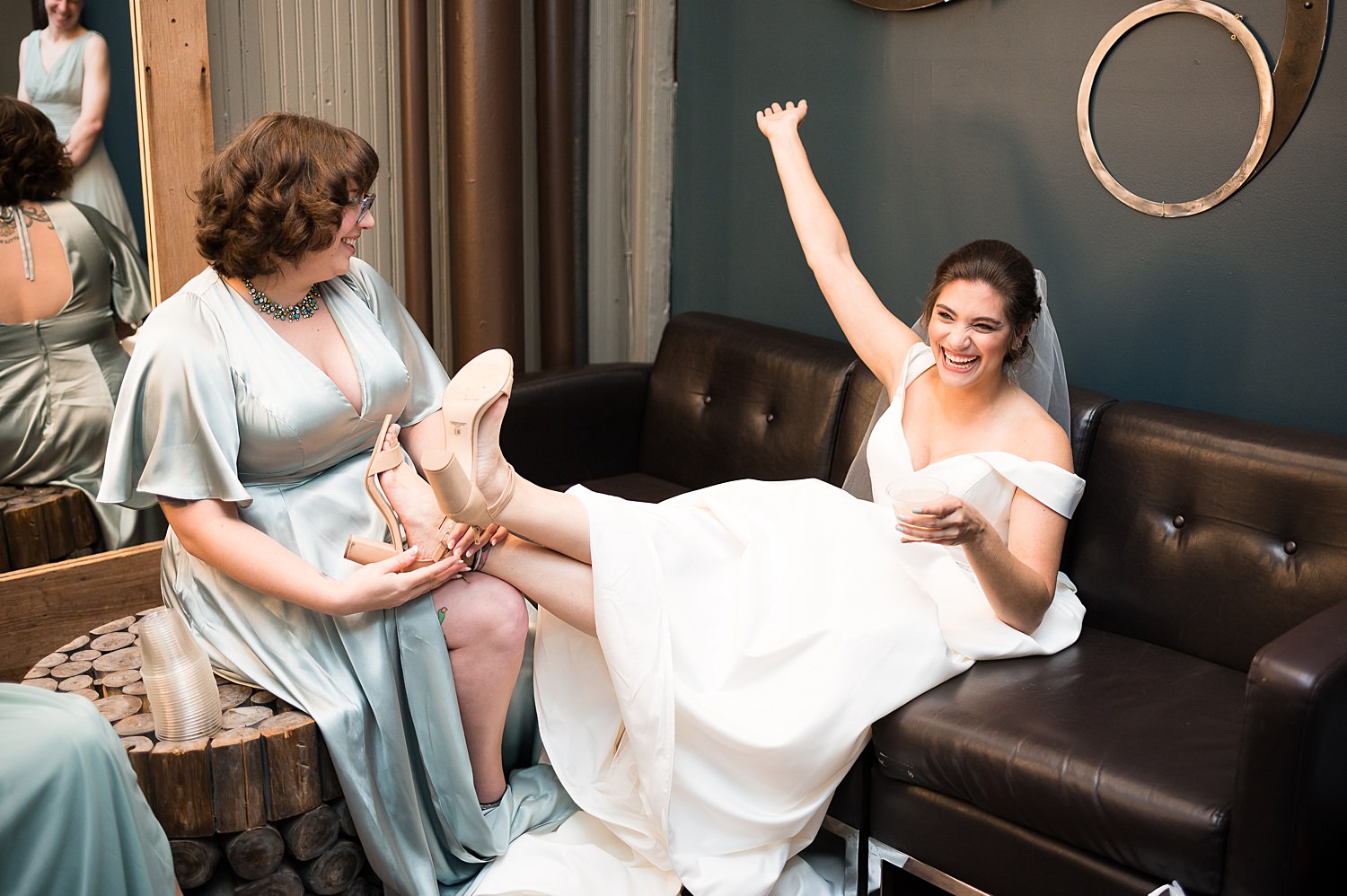 Bride has champagne toast on wedding day.