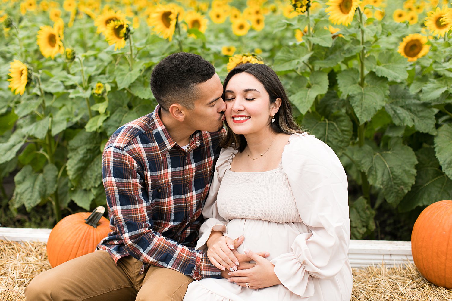 Couple sits in sunflower field in Murfreesboro TN