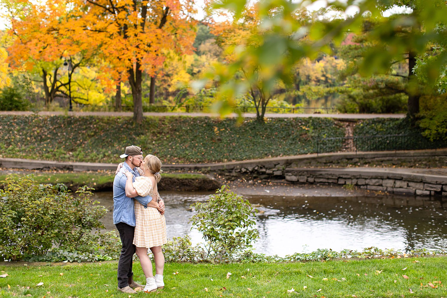 Couple kisses by river in Nashville, Tennessee