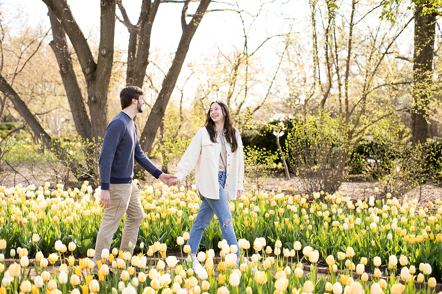 Couple walks in tulips at Chicago Botanic Garden