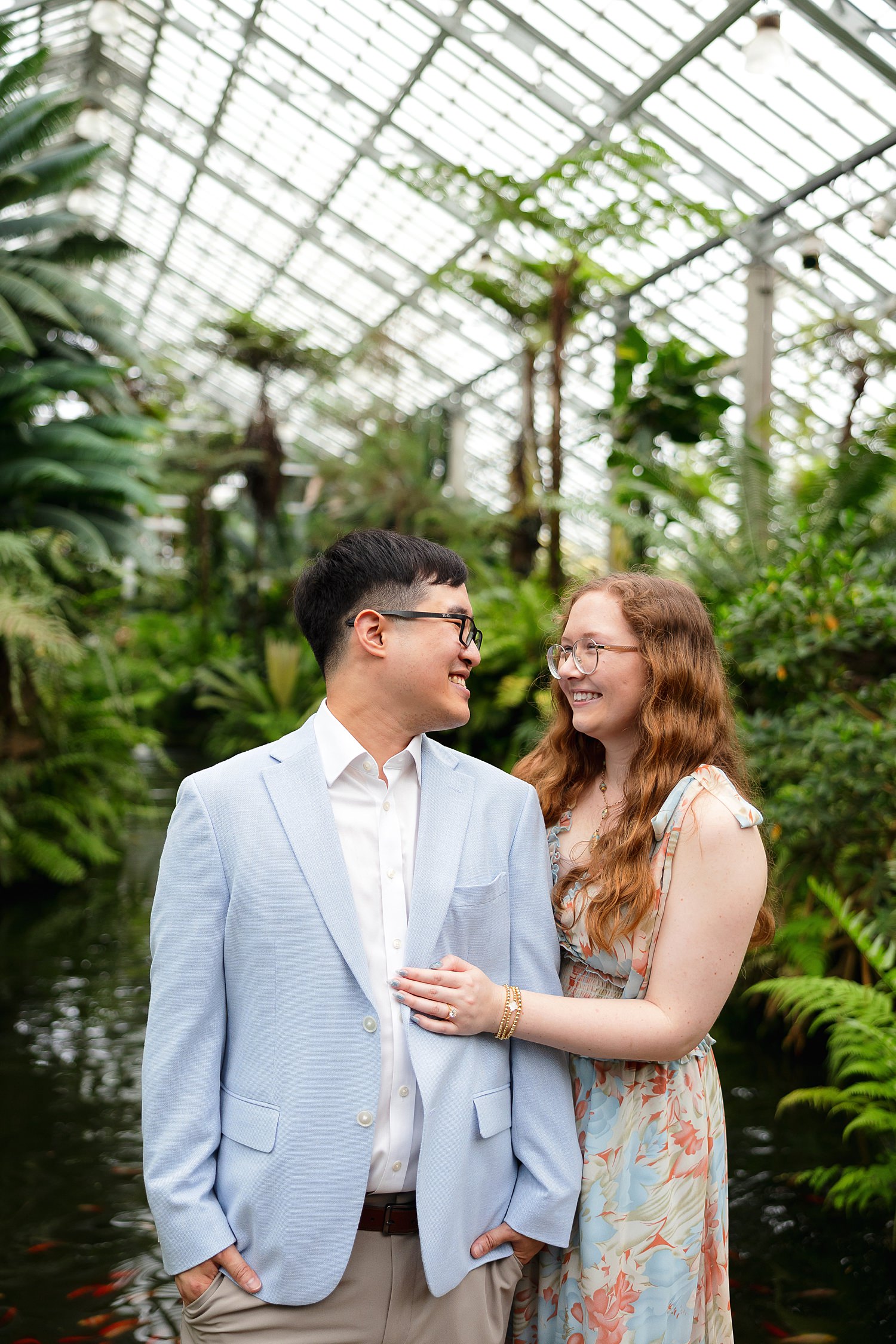 Couple smiles inside Garfield Park Conservatory