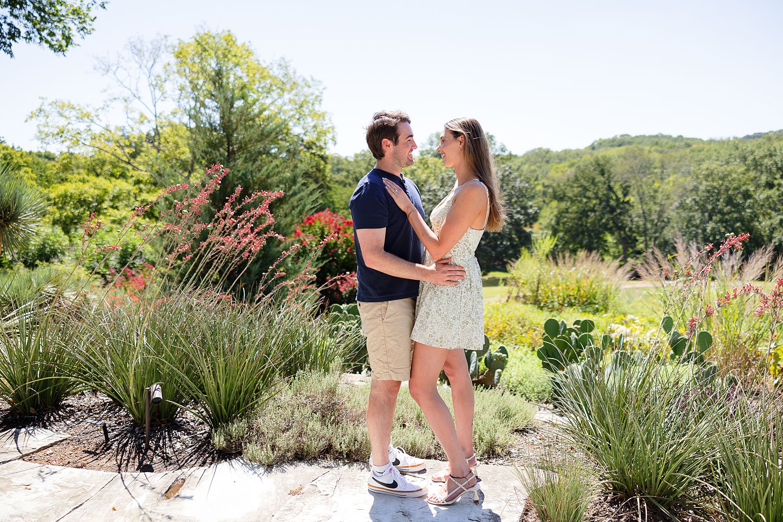 Engaged couple at Sigourney Cheek Literary Garden