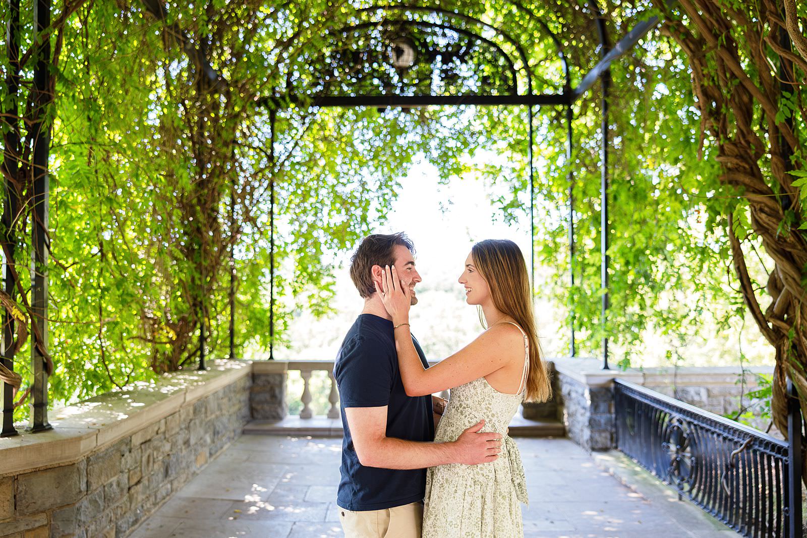 Engaged couple at Wisteria Arbor at Cheekwood in Nashville.