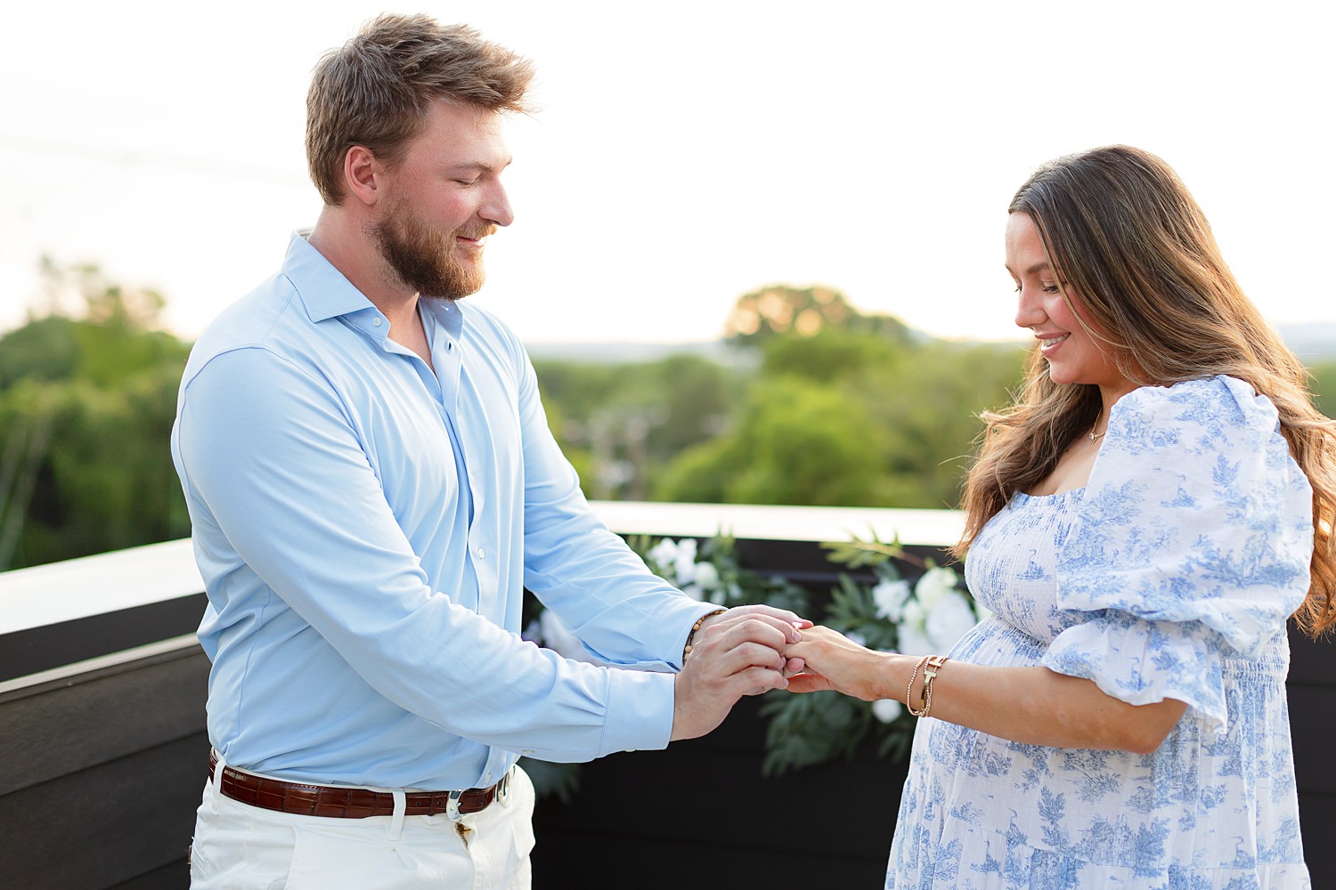 Couple engaged on rooftop in Nashville