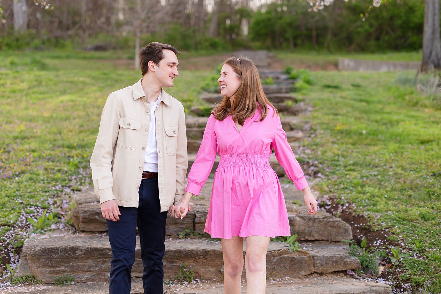 Engaged couple walking at Shelby Bottoms Greenway