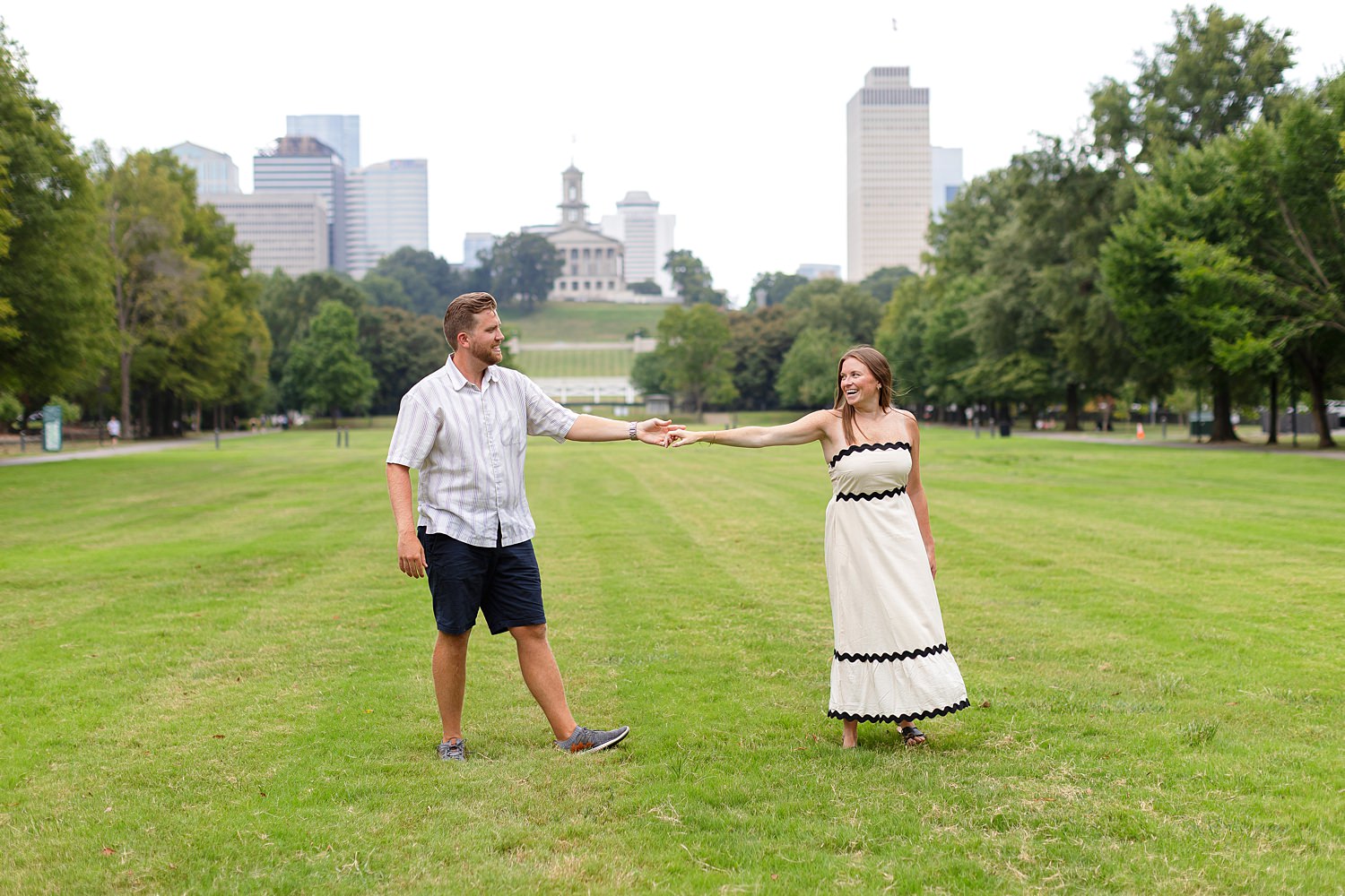 Engaged couple dancing at Bicentennial Capitol Mall State Park