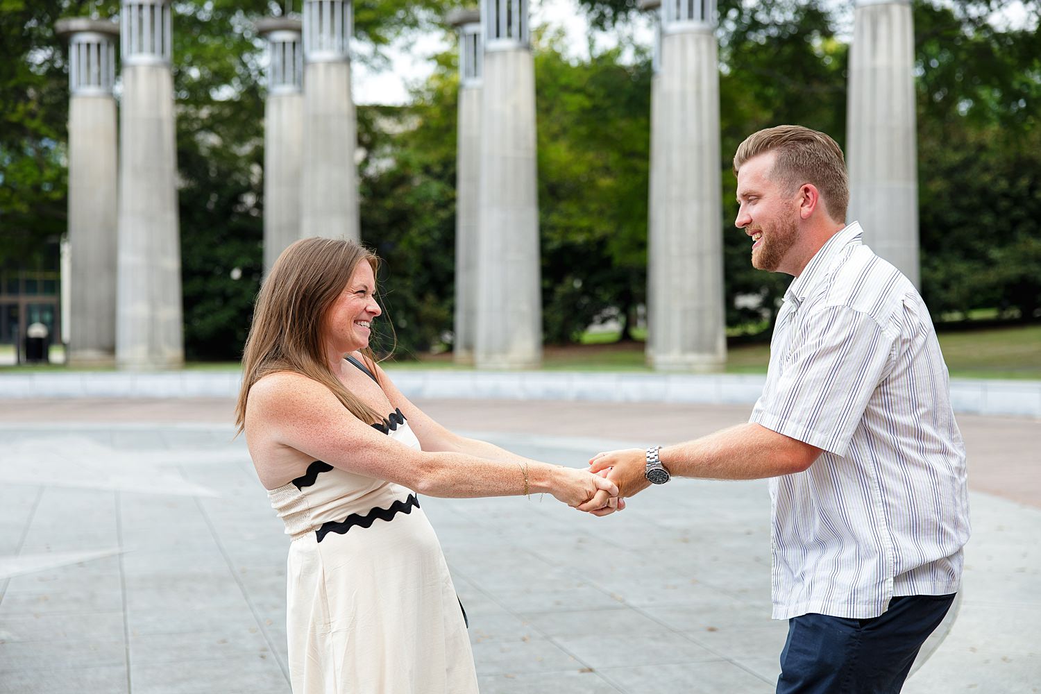 Engaged couple by the carillion bells at Bicentennial Capitol Mall State Park